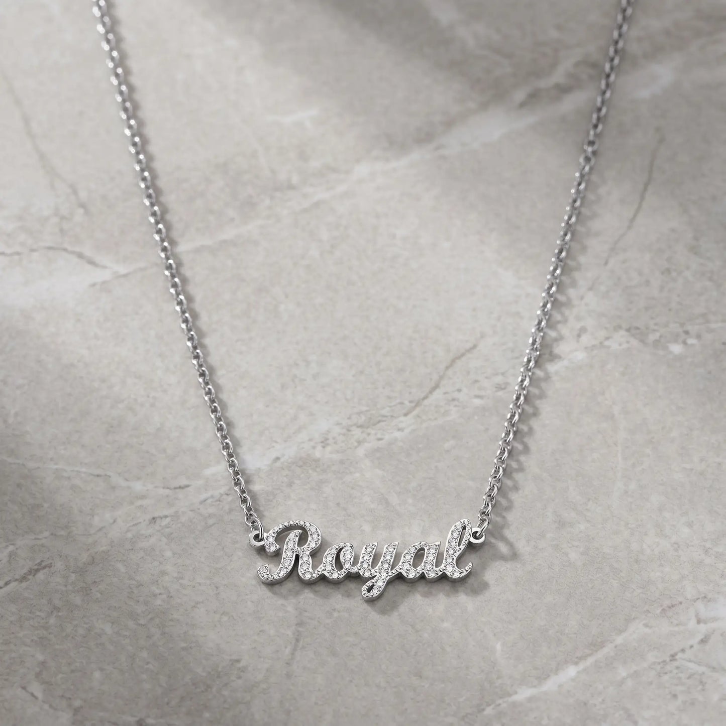 Crystal Name Wrist Chain in Silver packshot - delicate rolo chain with iced cursive nameplate by AUREATE