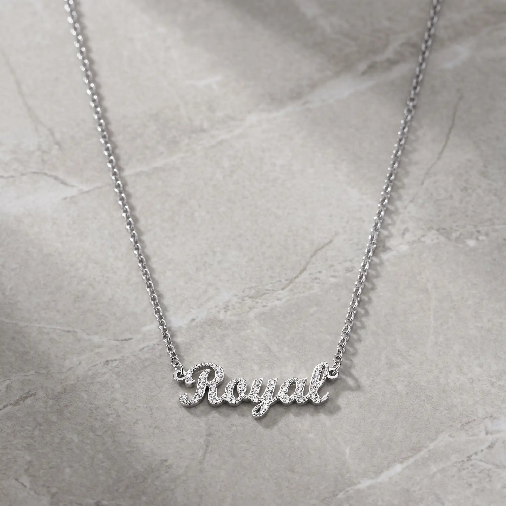 Crystal Name Wrist Chain in Silver packshot - delicate rolo chain with iced cursive nameplate by AUREATE