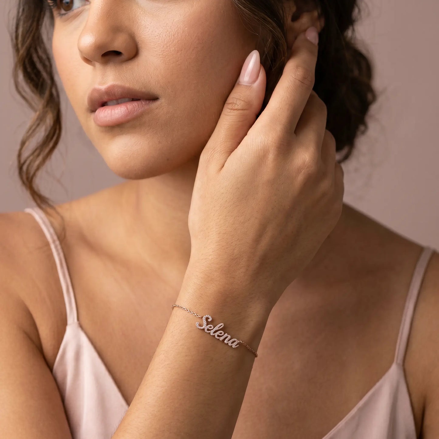 Crystal Name Wrist Chain in Rose Gold worn on wrist - dainty cursive crystal pave personalised name bracelet by AUREATE