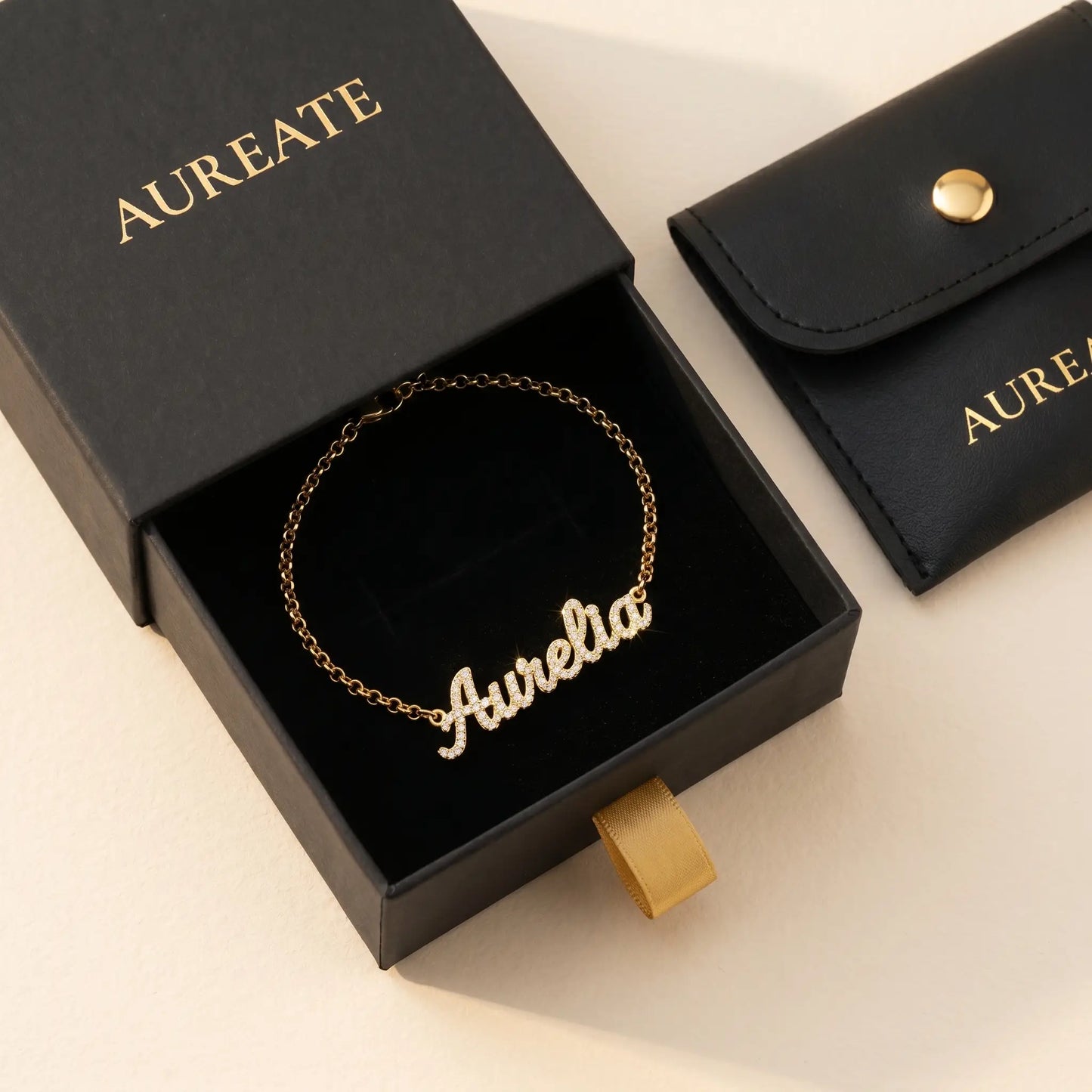 Crystal Name Wrist Chain in 18K Gold gift box - AUREATE branded slide-drawer packaging with leather pouch (regen v2 bracelet)