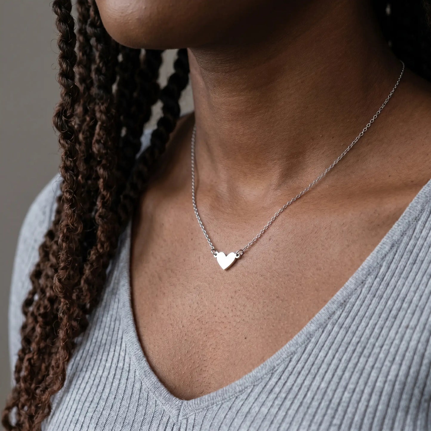 Timeless Heart Pendant Chain by AUREATE in silver tone worn at the collarbone, dainty closed heart pendant