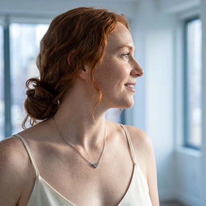 Timeless Heart Pendant Chain by AUREATE in silver tone profile subtle smile NYC loft morning