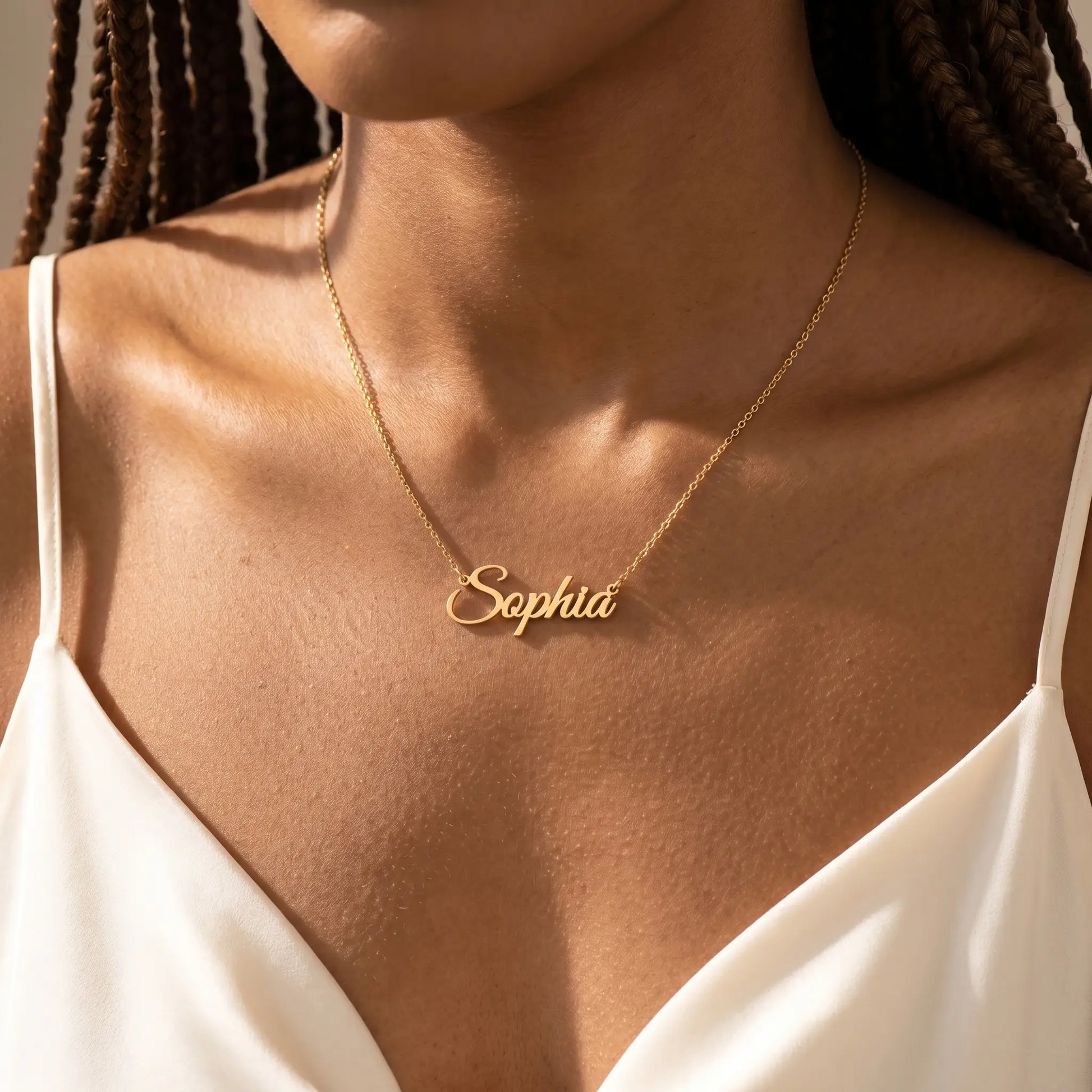 Personalized Script Name Chain 18K gold worn at collarbone close-up by AUREATE