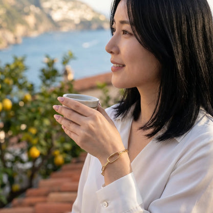 Gold paperclip bracelet Amalfi coast profile lifestyle aspirational