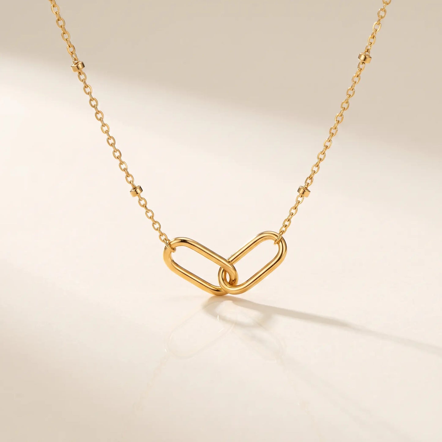 Linked Loop Necklace 18K gold packshot hero studio