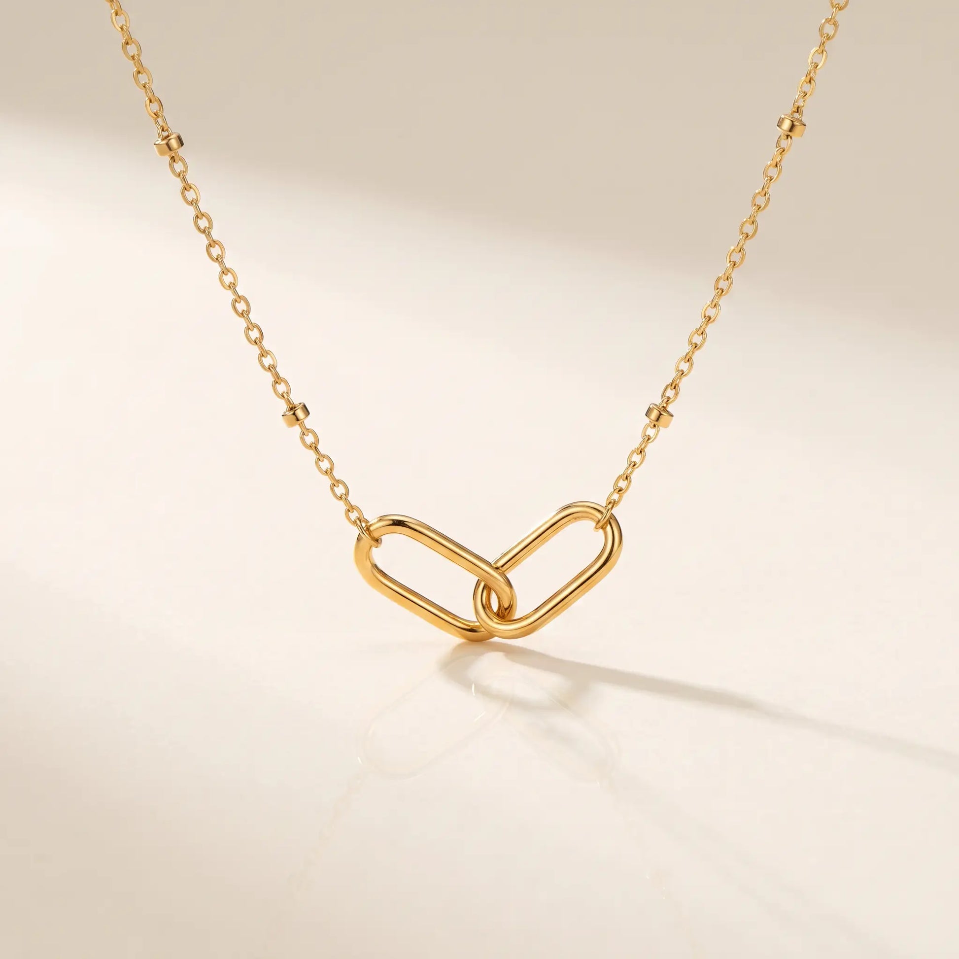 Linked Loop Necklace 18K gold packshot hero studio