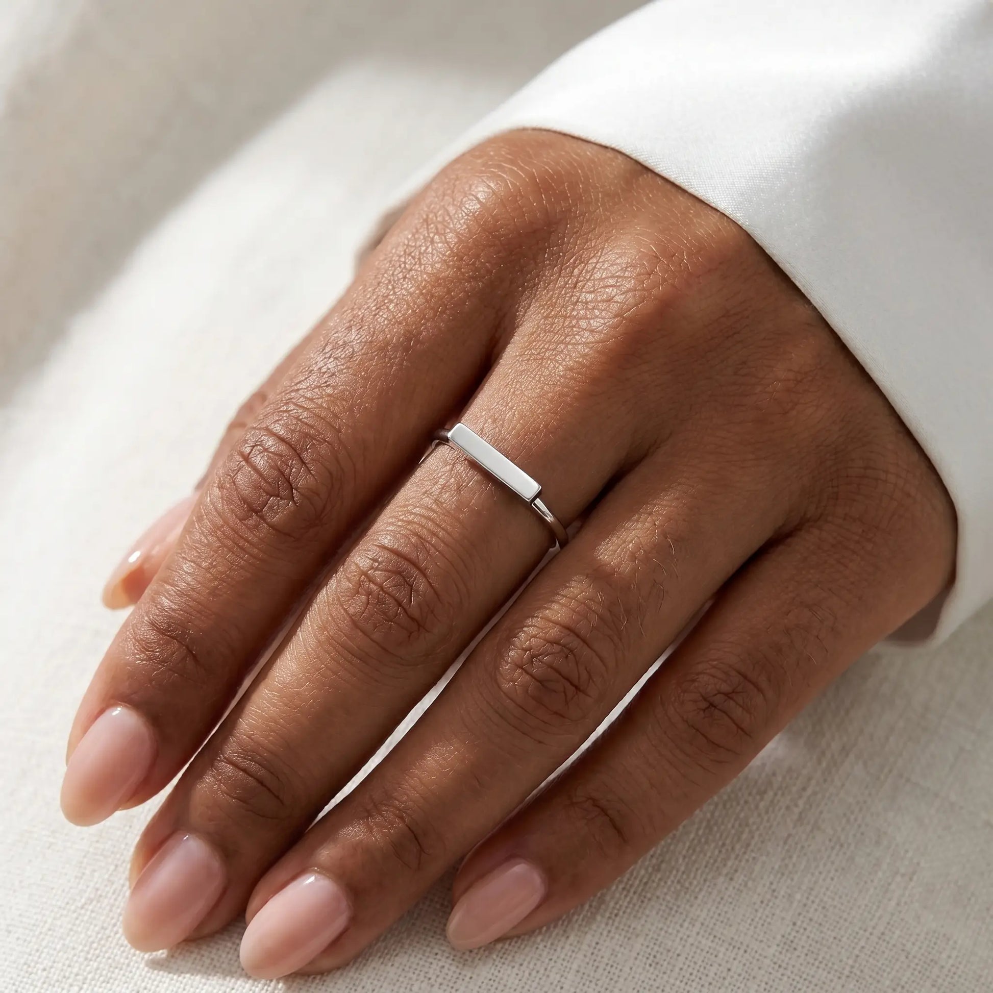 Mini bar ring silver stainless steel worn close-up on hand