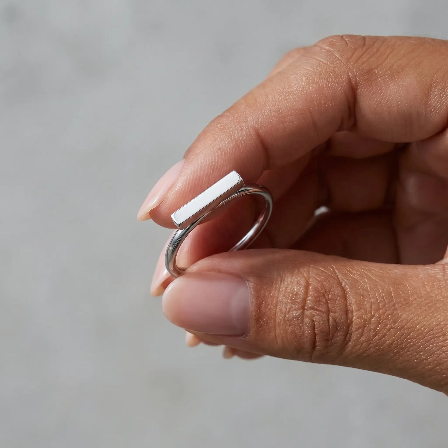 Mini bar ring silver stainless steel held in hand intimate