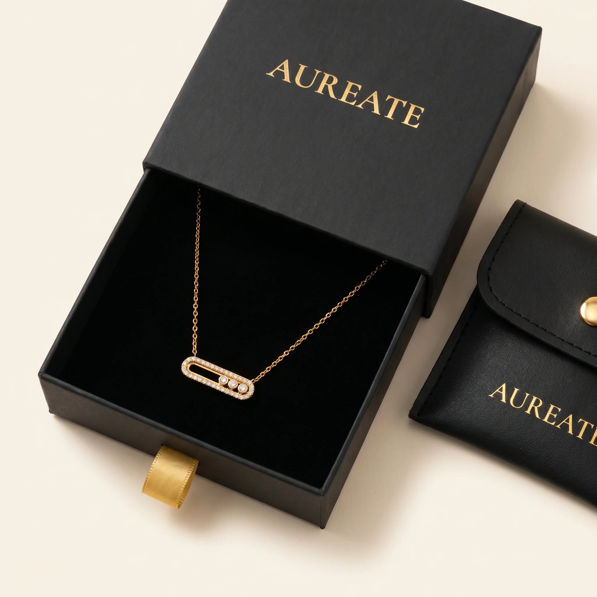 AUREATE gold paperclip pavé necklace in matte black slide-drawer gift box with leather pouch