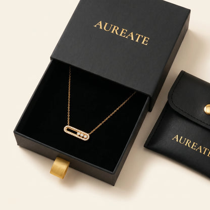 AUREATE gold paperclip pavé necklace in matte black slide-drawer gift box with leather pouch