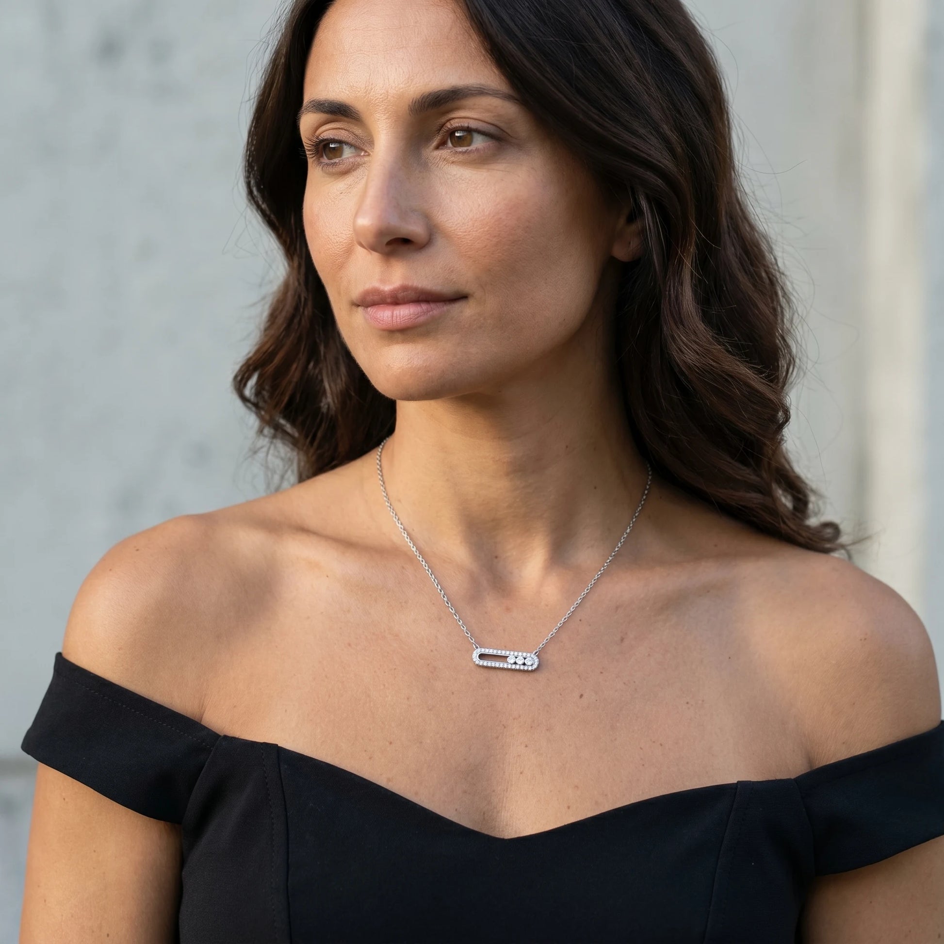 Dainty silver pavé bar necklace styled with black off-shoulder bustier editorial portrait