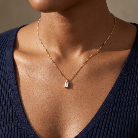 Baguette pendant necklace gold worn close-up