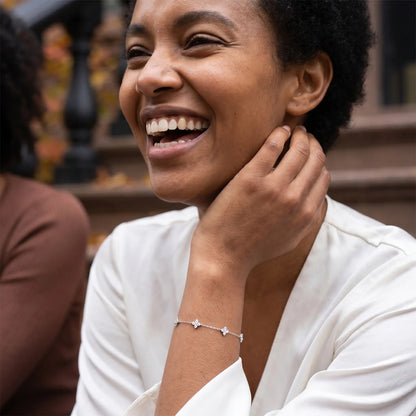 Silver clover bracelet joy candid laugh Ethiopian Brooklyn brownstone