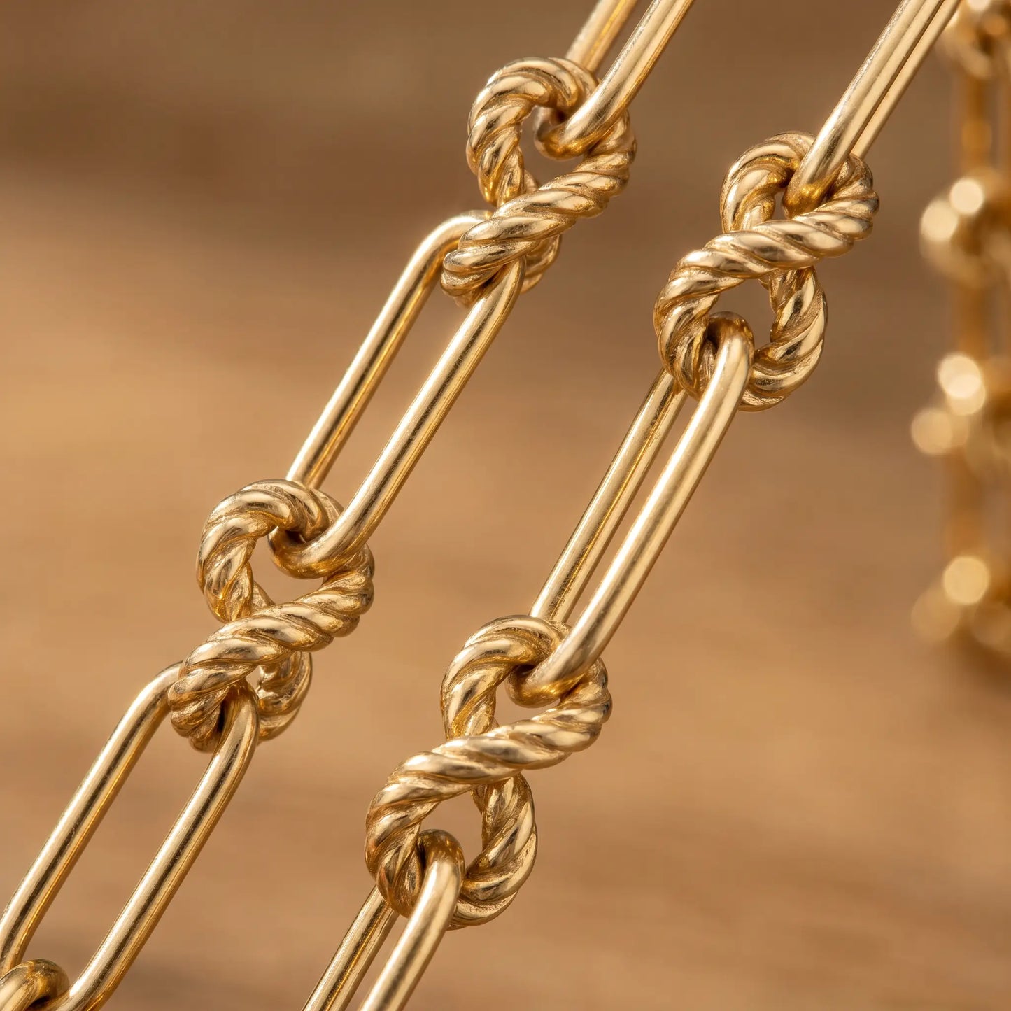 Knot chain necklace gold macro detail figure-8 sailor knot links