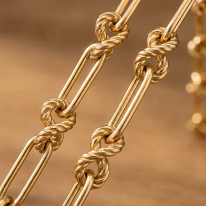 Knot chain necklace gold macro detail figure-8 sailor knot links