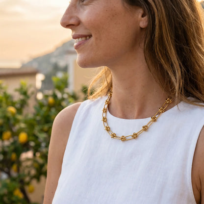 Knot chain necklace gold lifestyle profile aspirational Amalfi terrace