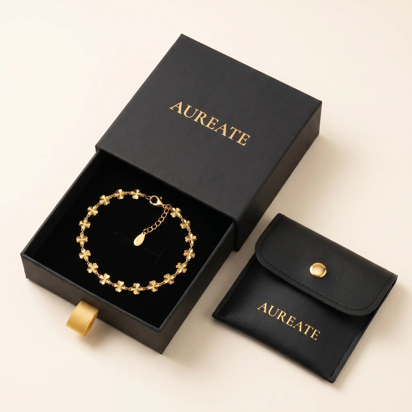AUREATE gift box with gold daisy anklet - matte black slide drawer with leather pouch and gold foil logo