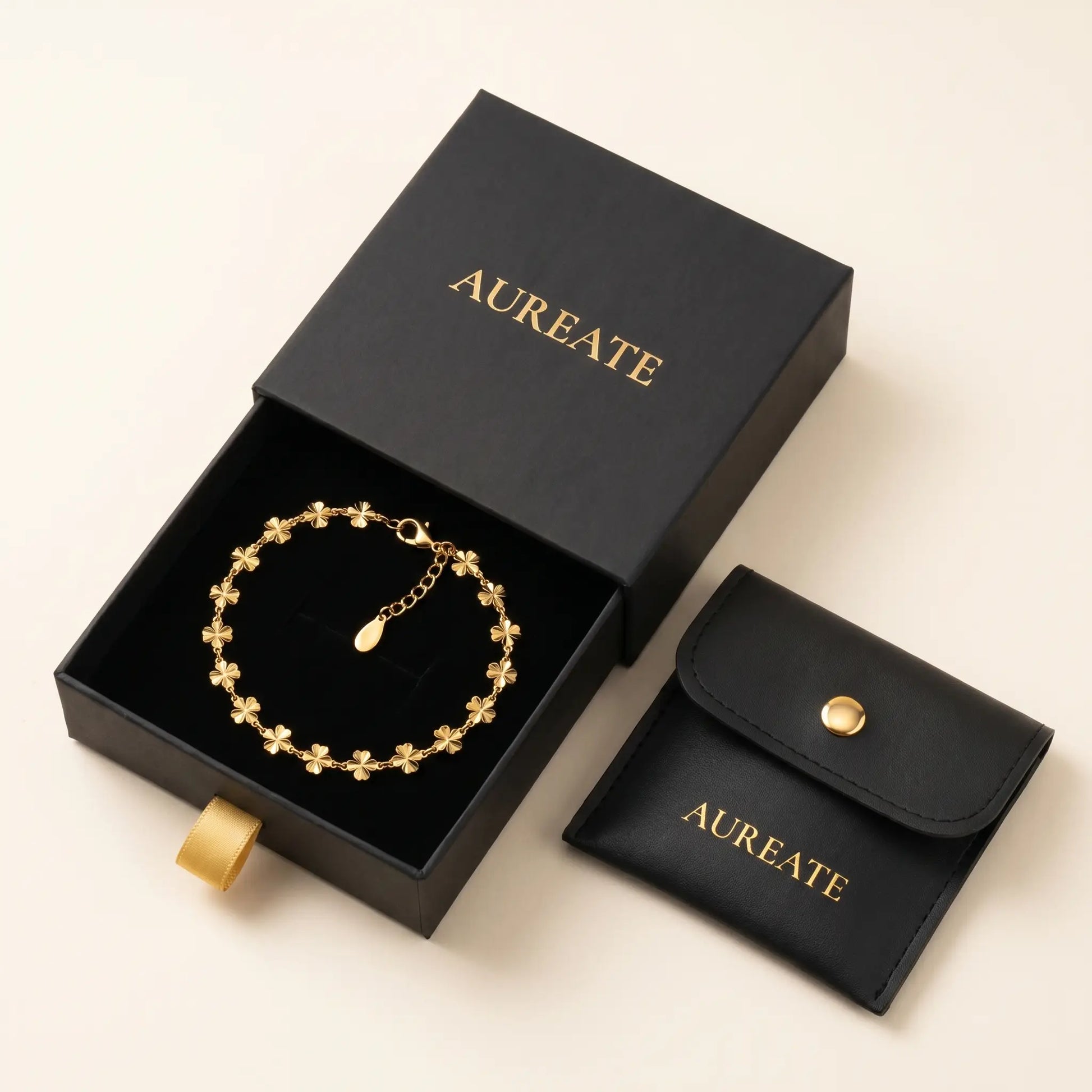 AUREATE gift box with gold daisy anklet - matte black slide drawer with leather pouch and gold foil logo