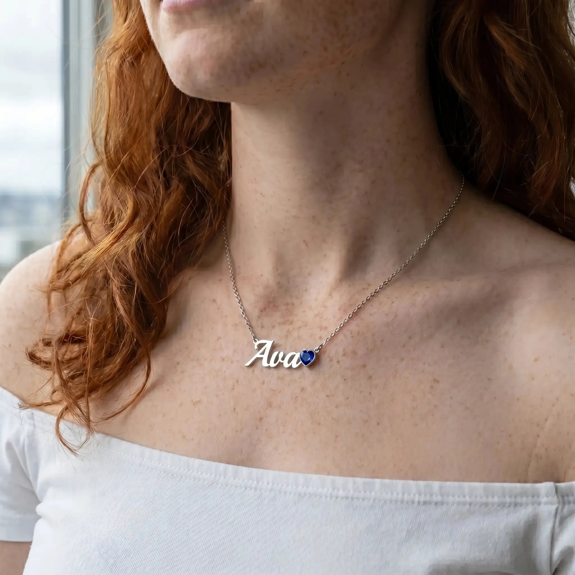 Birth Stone Letter Drop Strand Silver worn close-up red-haired model with Ava and September Sapphire heart birthstone