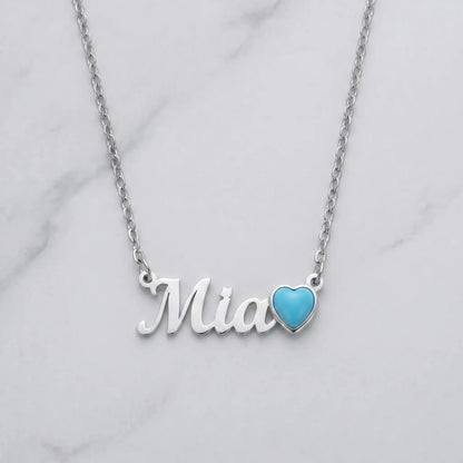 Birth Stone Letter Drop Strand Silver flat-lay marble with Mia and December Turquoise heart birthstone