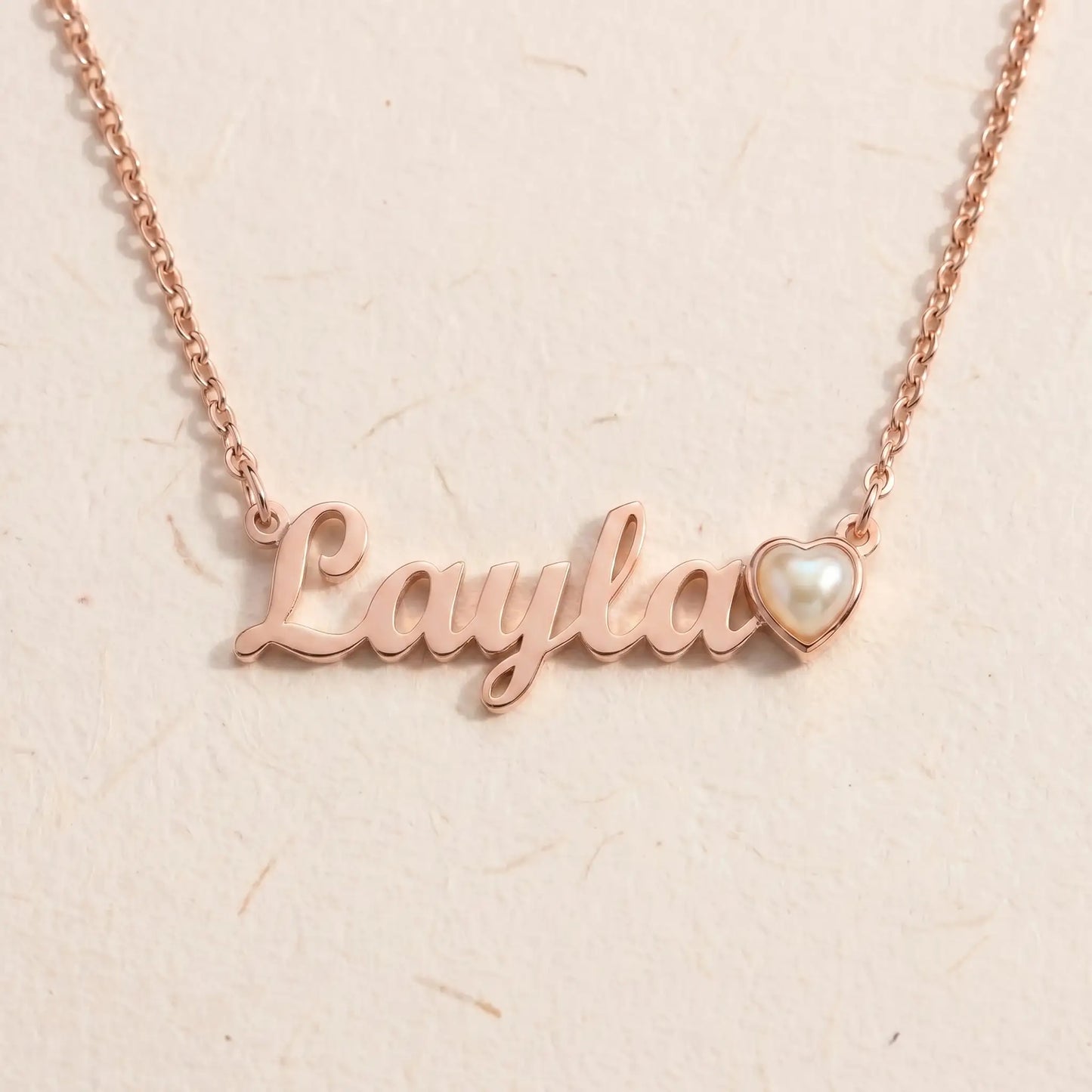 Birth Stone Letter Drop Strand Rose Gold packshot with Layla and June Pearl heart birthstone