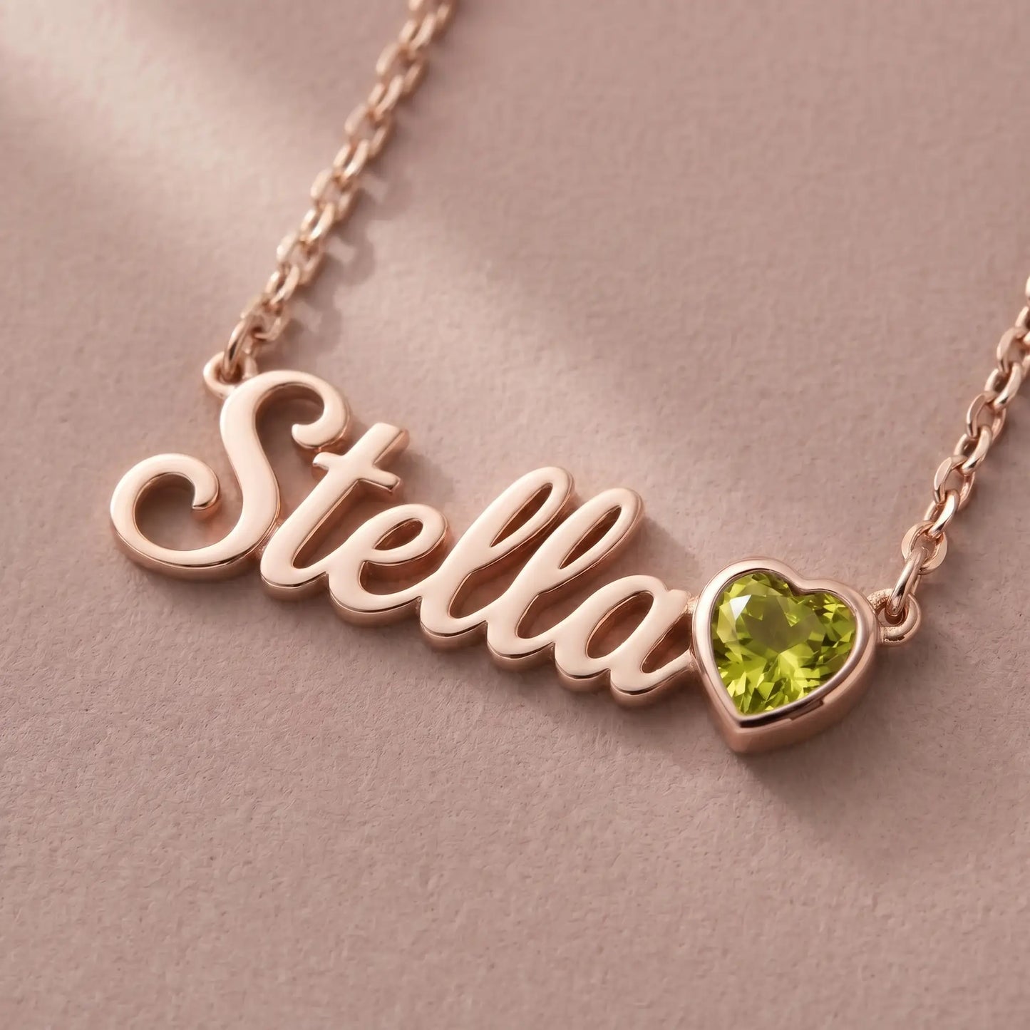 Birth Stone Letter Drop Strand Rose Gold macro detail with Stella and August Peridot heart birthstone