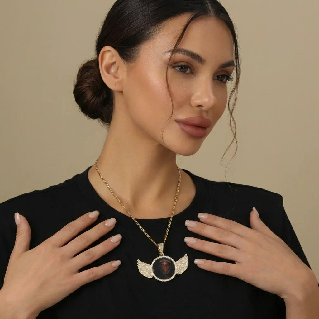 Iced Angel Photo Pendant Necklace worn by a woman, featuring angel-wing design and personalized photo option, AUREATE brand.
