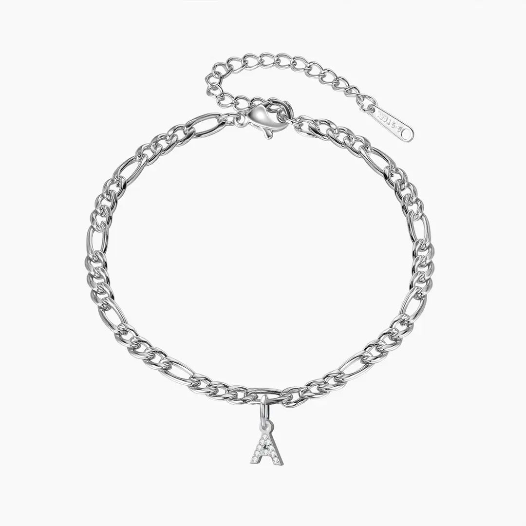 Iced Letter Anklet with Figaro Chain by AUREATE featuring a silver chain with an initial 'A' charm.