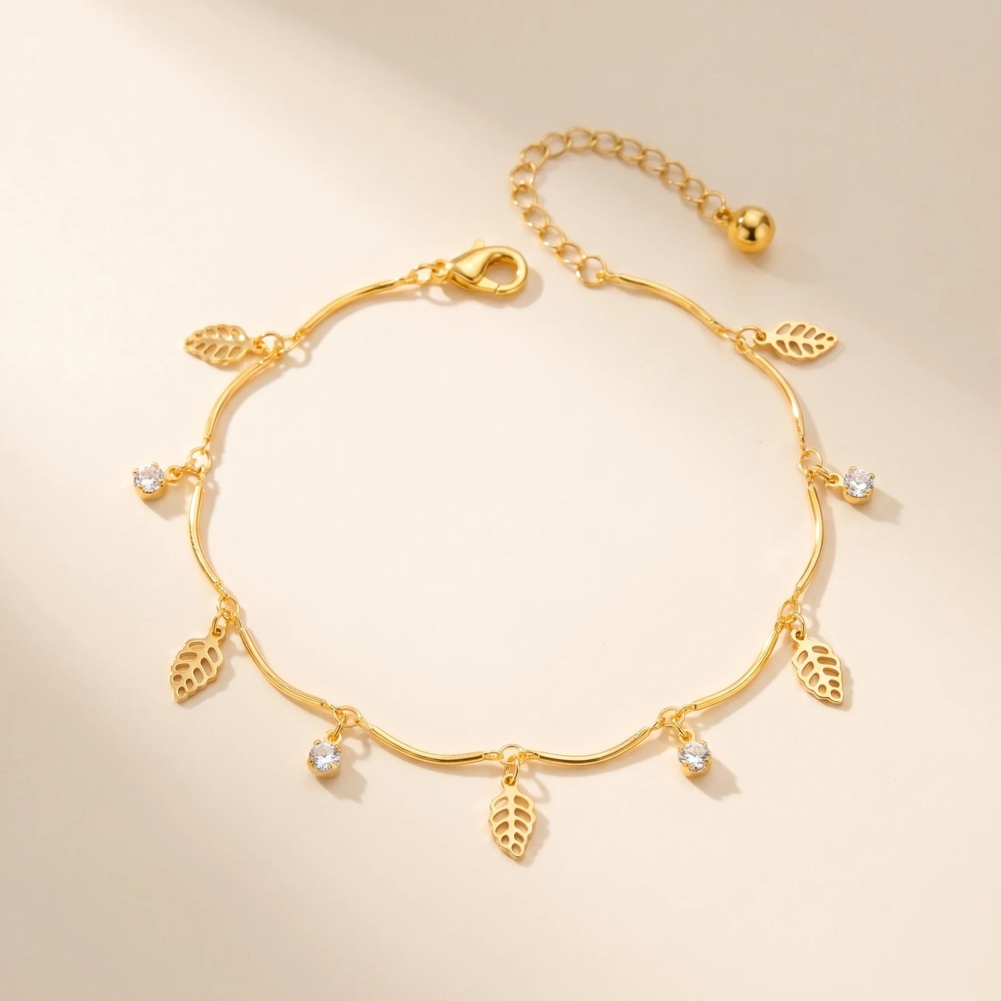 Gold leaf anklet packshot off-white background closed oval loop