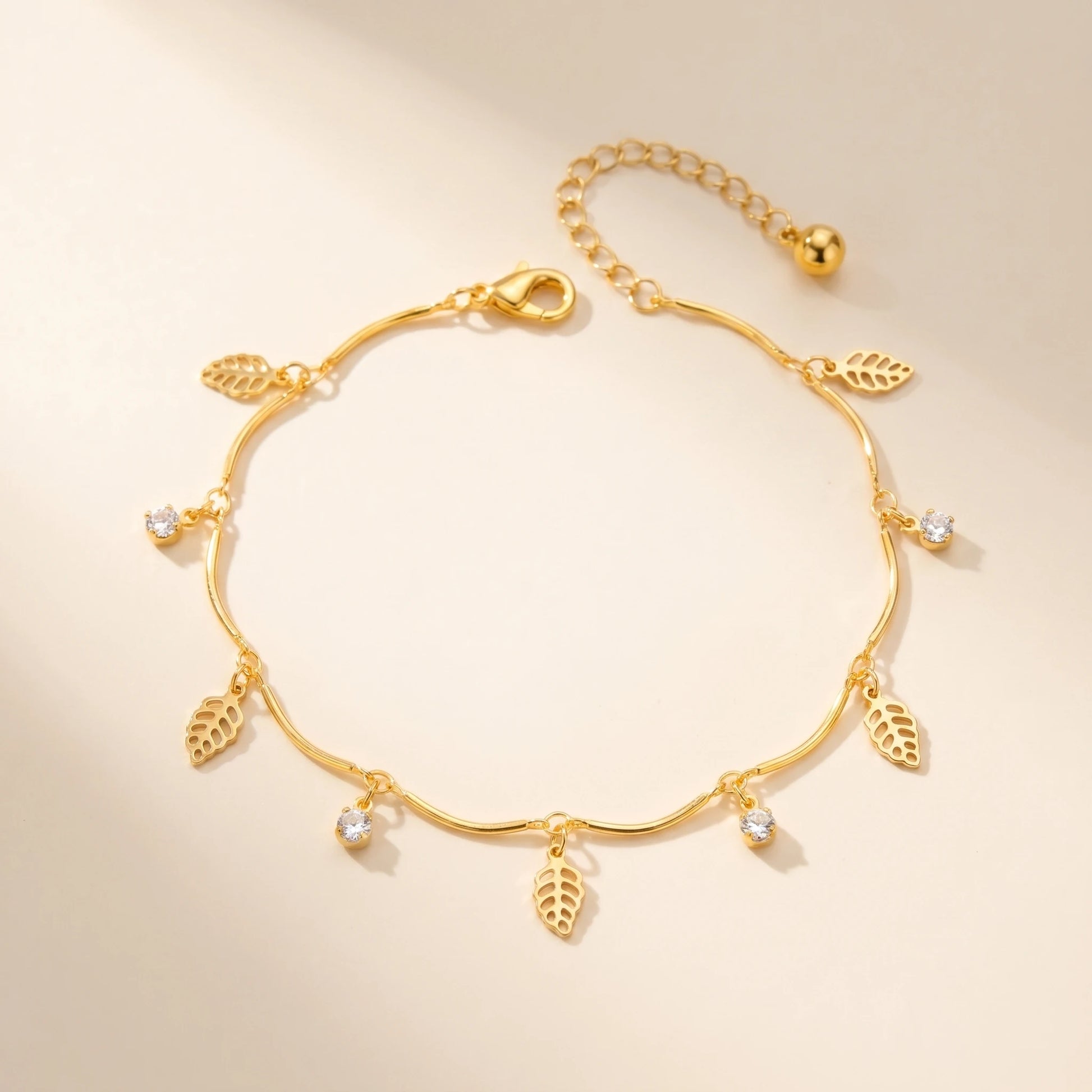 Gold leaf anklet packshot off-white background closed oval loop