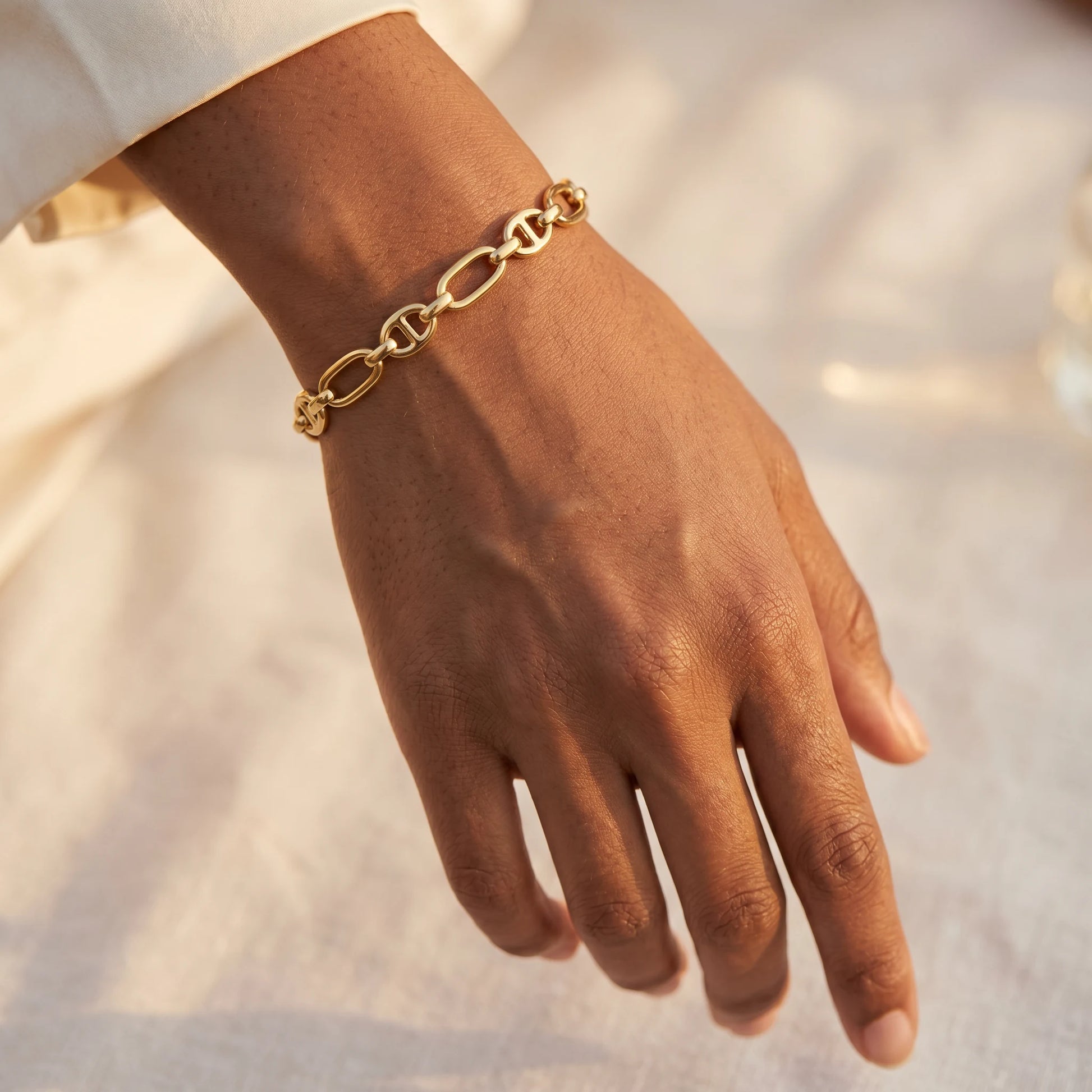 Mariner Link Bracelet gold worn close-up dorsal wrist