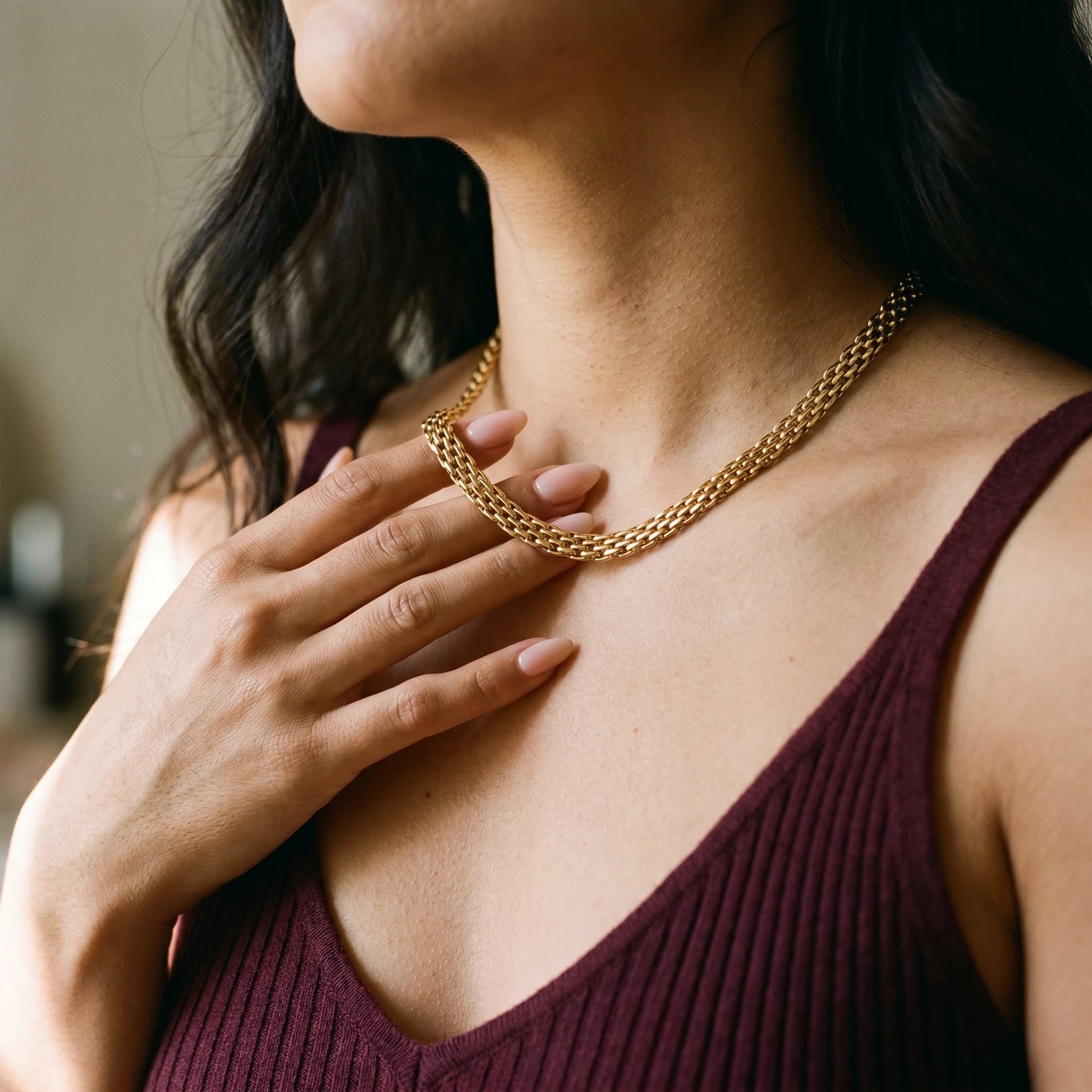 Mesh chain necklace gold hand to throat tender close-up