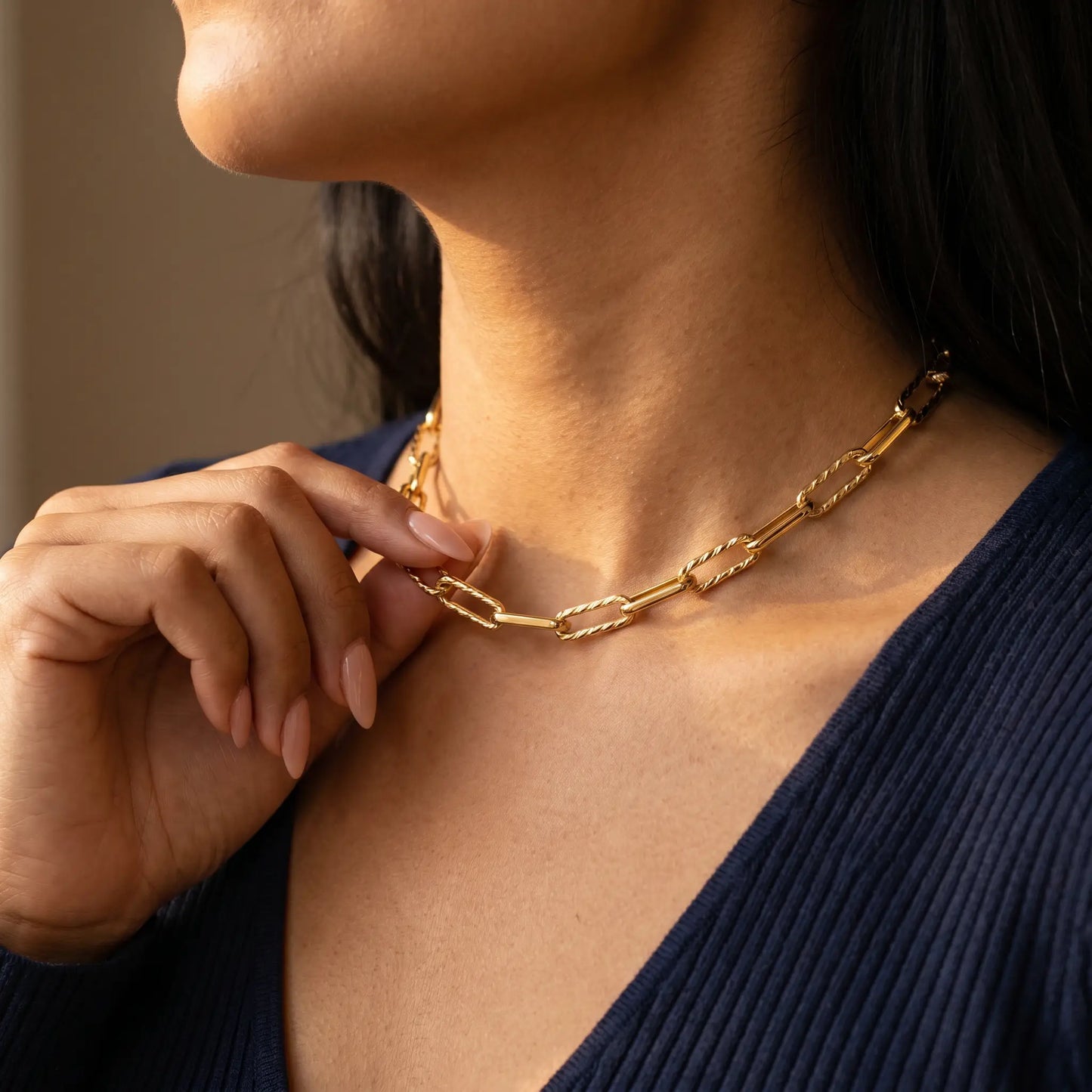 Mixed paperclip necklace gold lifestyle hand-to-jewelry intimate close-up