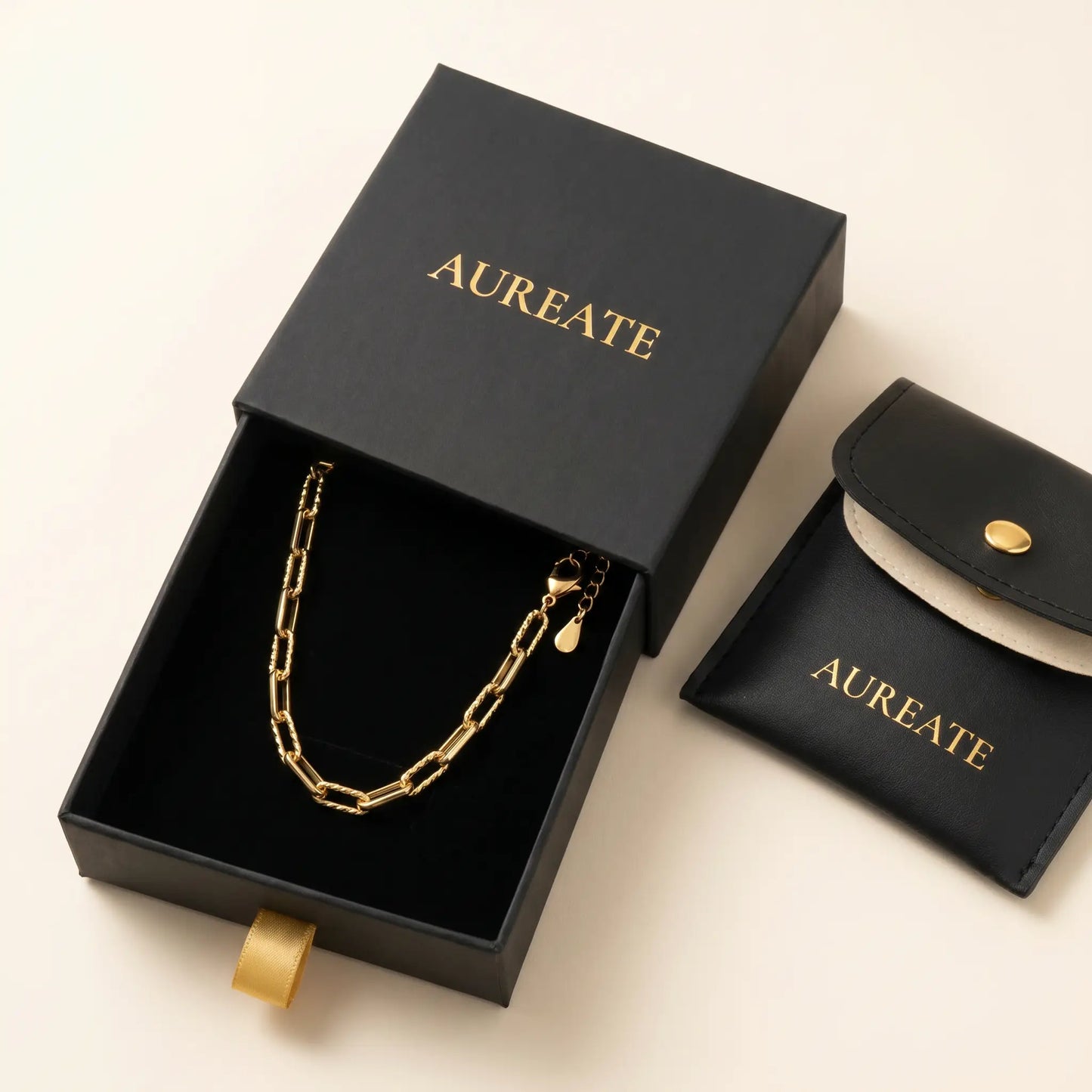Mixed paperclip necklace gold AUREATE gift box — matte black slide drawer with leather pouch and gold serif logo