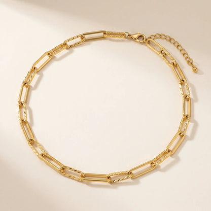 Mixed paperclip necklace gold packshot — alternating textured and smooth rectangular links 7.5mm wide