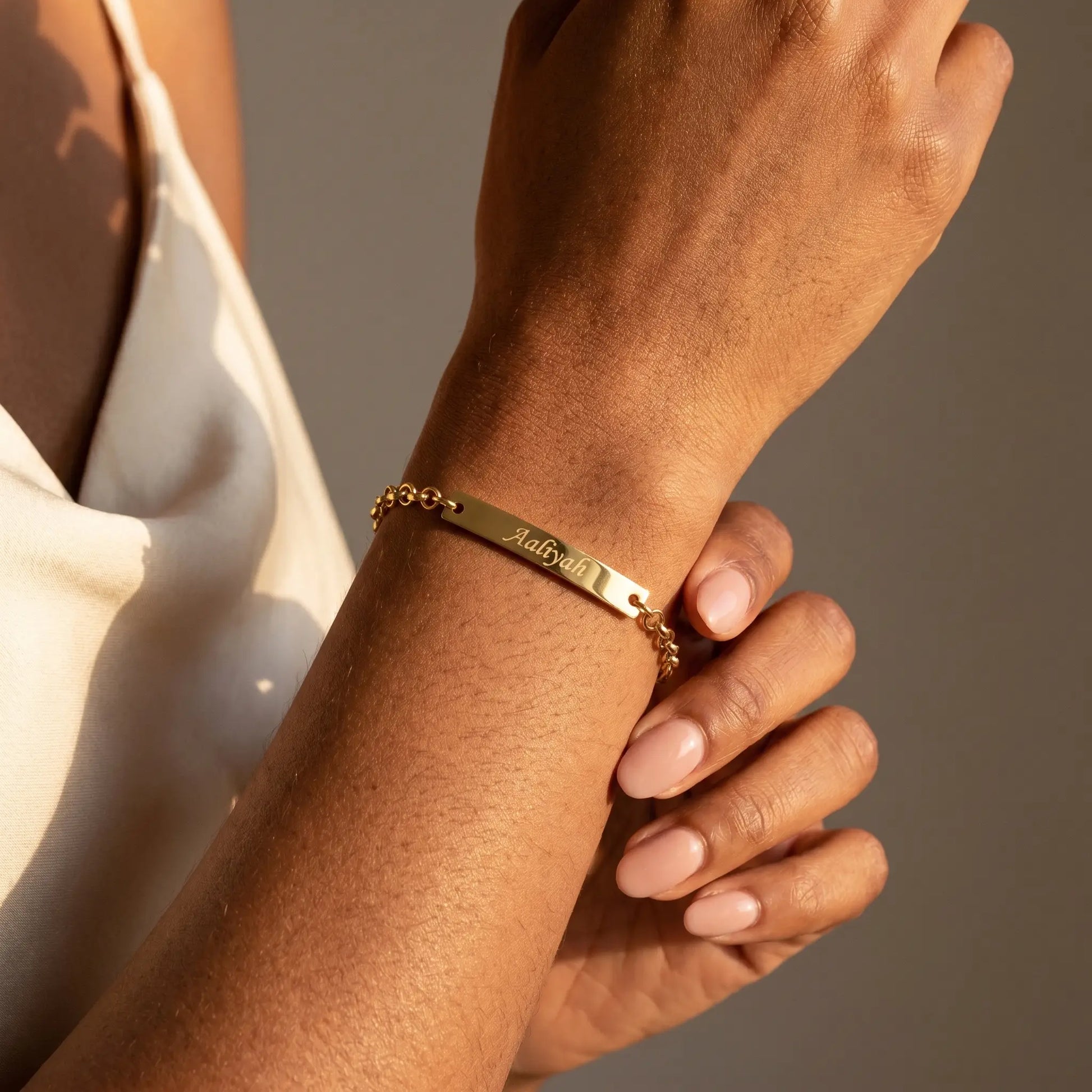 Engraved Gold Bar Bracelet AUREATE Bracelet 18K Gold Plated worn close-up Aaliyah