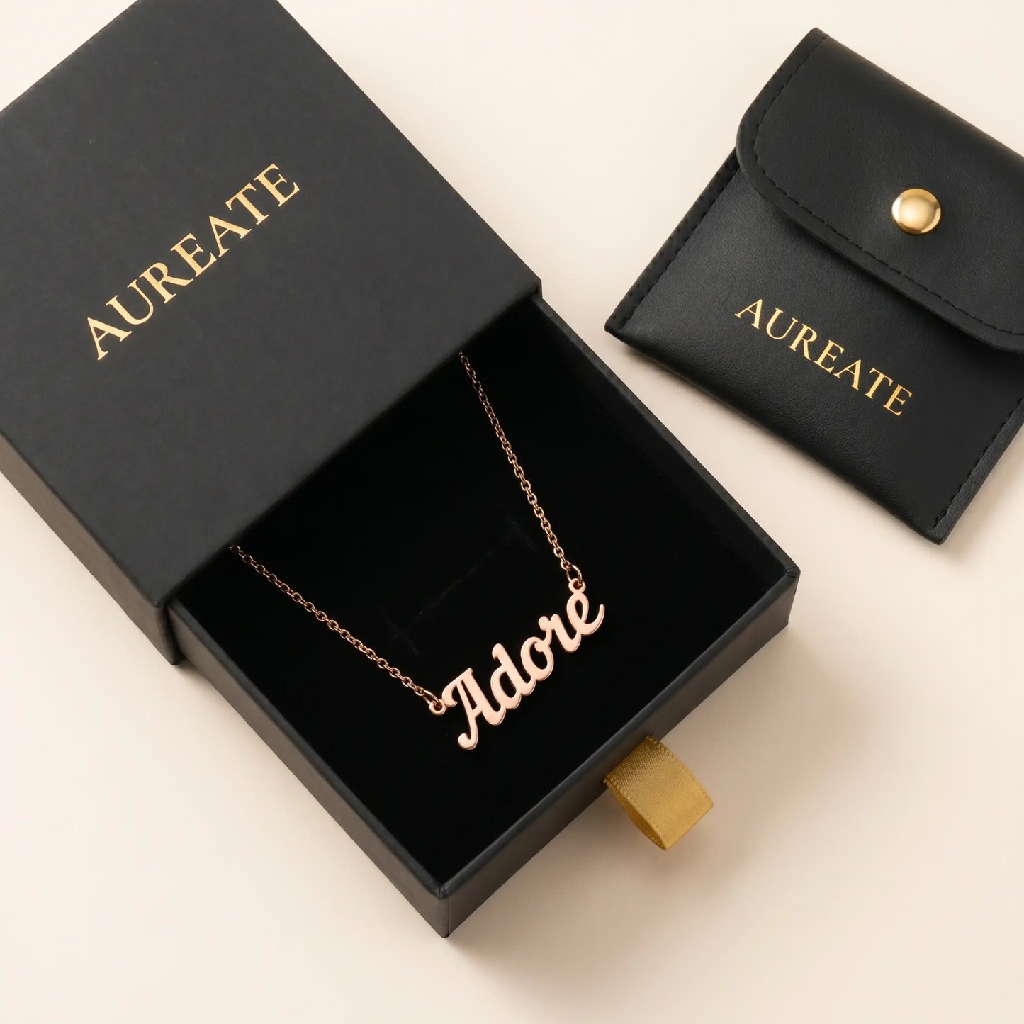 Personalised Plate Chain in 18K Gold presented in a signature AUREATE gift box.