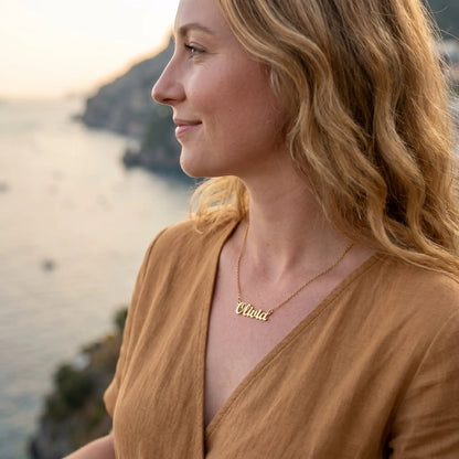 Personalised Plate Chain in 18K Gold worn by a woman in AUREATE brand jewelry.