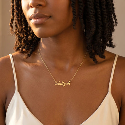 Personalised Plate Chain in 18K Gold worn by model, from AUREATE, showcasing customizable name design.