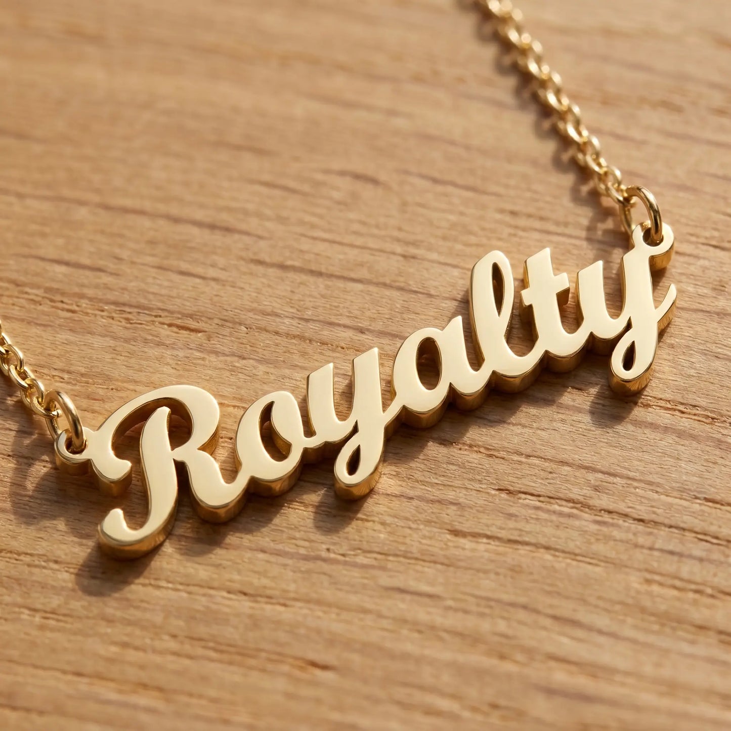 Personalised Plate Chain in 18K Gold by AUREATE featuring a 'Royalty' pendant in gold.