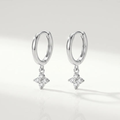Silver petite clover huggie earrings packshot pair