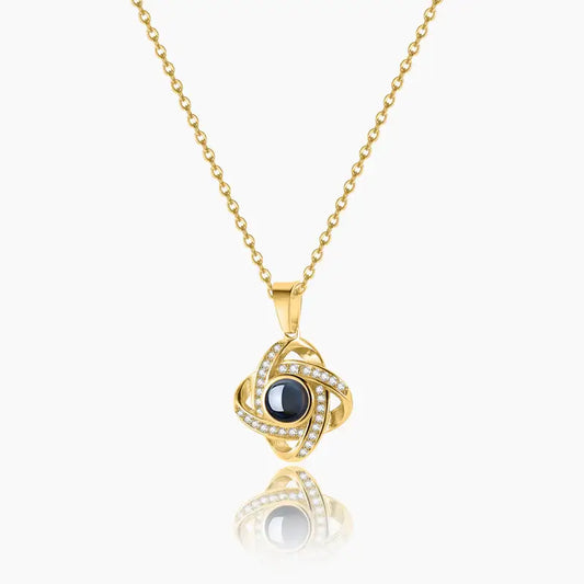 Photo Projection Necklace by AUREATE featuring gold design and sparkling accents.