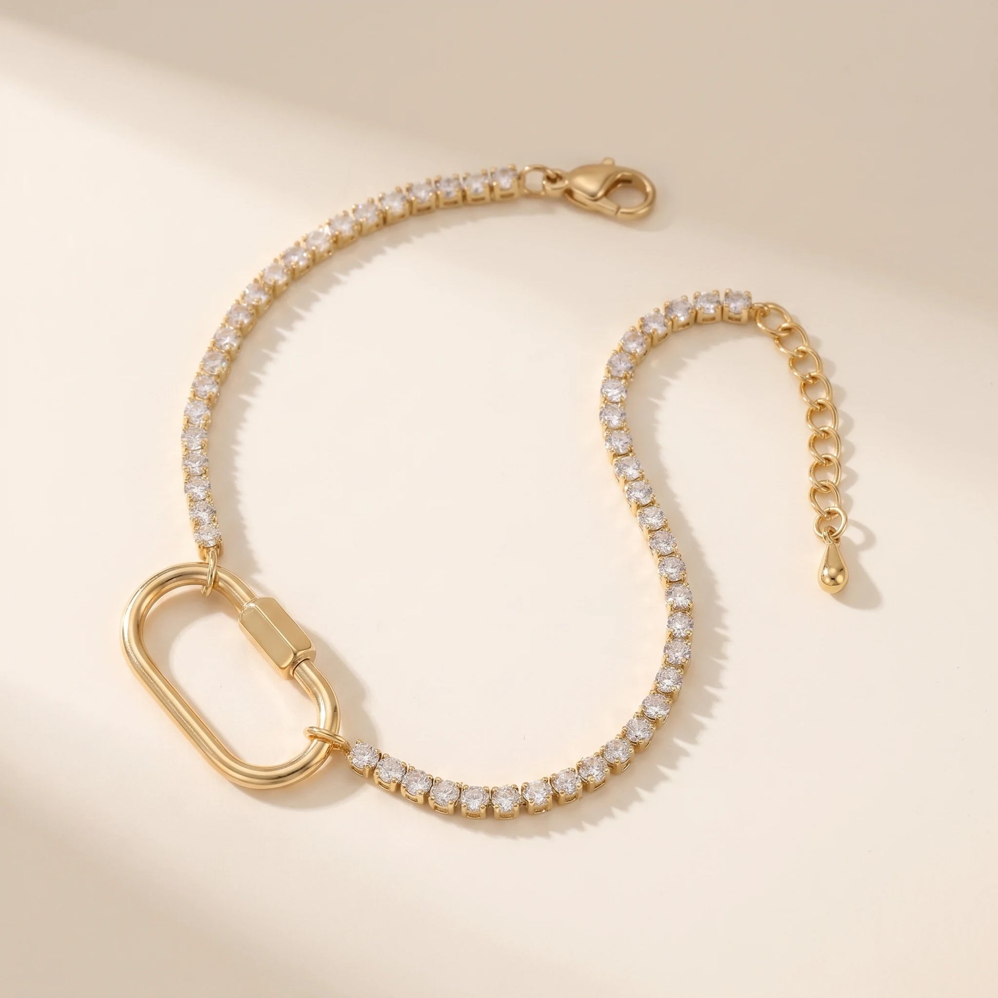 Gold tennis bracelet with oval carabiner lock pendant - packshot 18K gold CZ pave stainless steel with 3cm cable extender