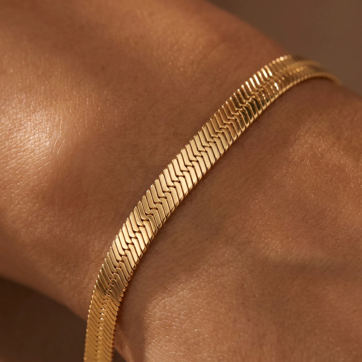 Gold herringbone bracelet macro weave detail