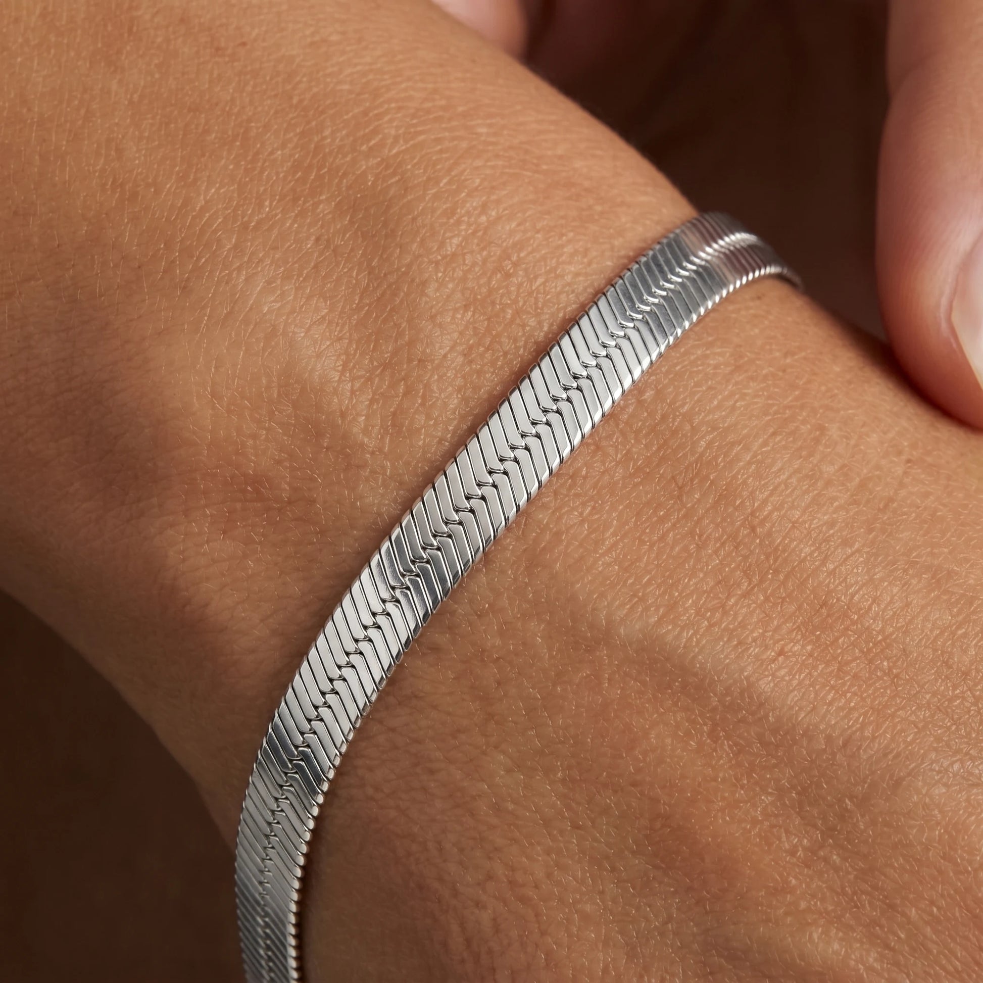 Silver herringbone bracelet macro weave detail