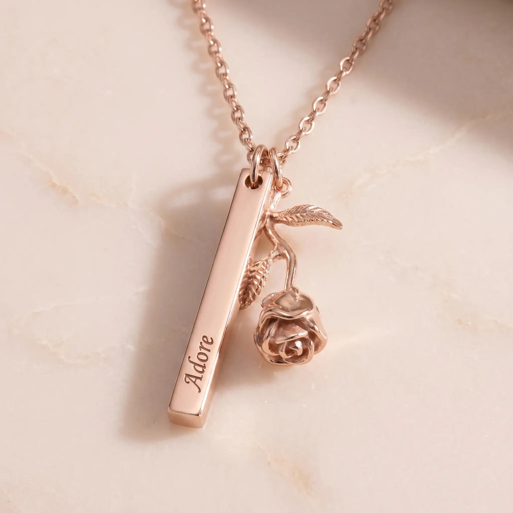 Rose Gold Engraved Bar Pendant in rose gold packshot with rose flower charm Adore engraving