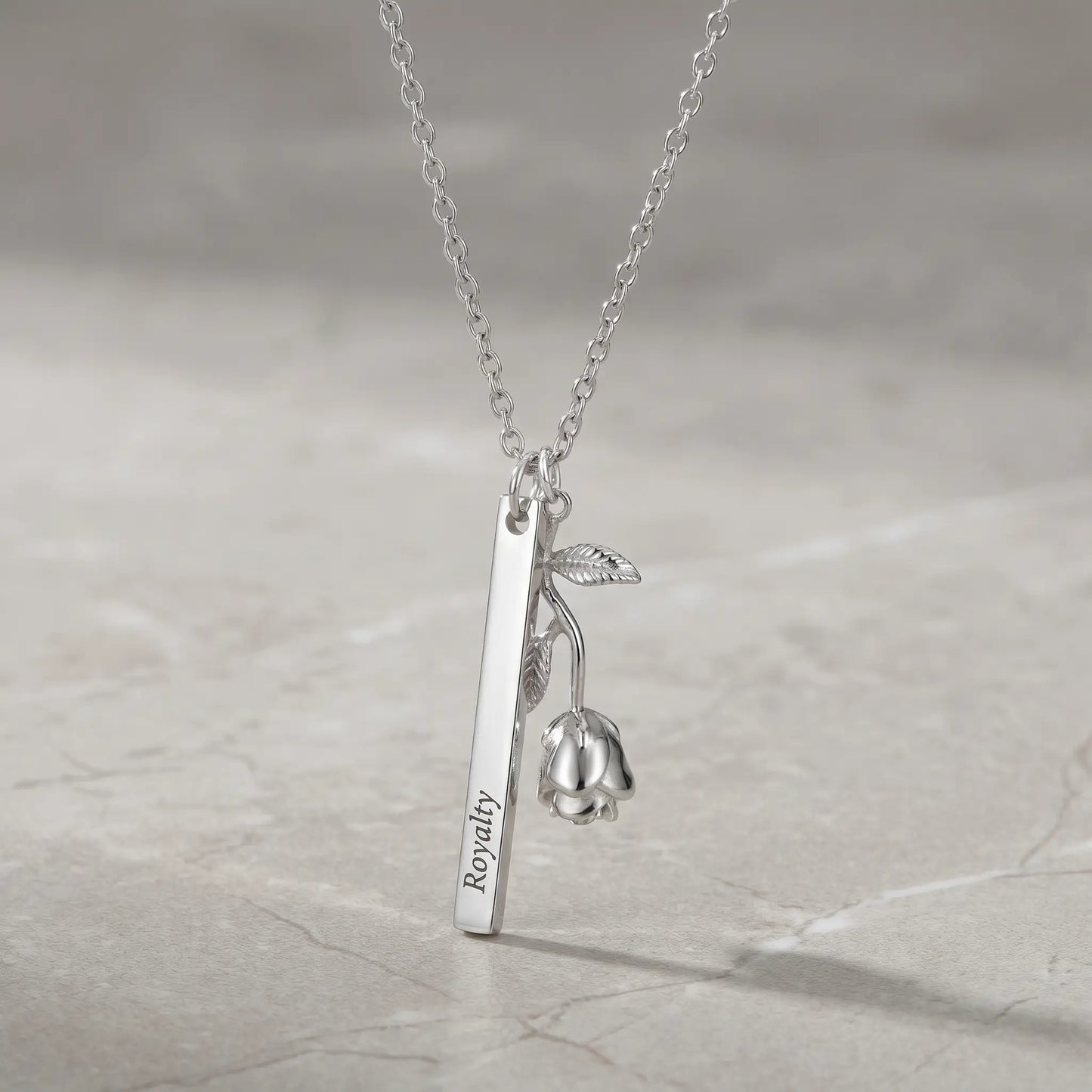 Rose Gold Engraved Bar Pendant in silver tone packshot with rose flower charm Royalty engraving