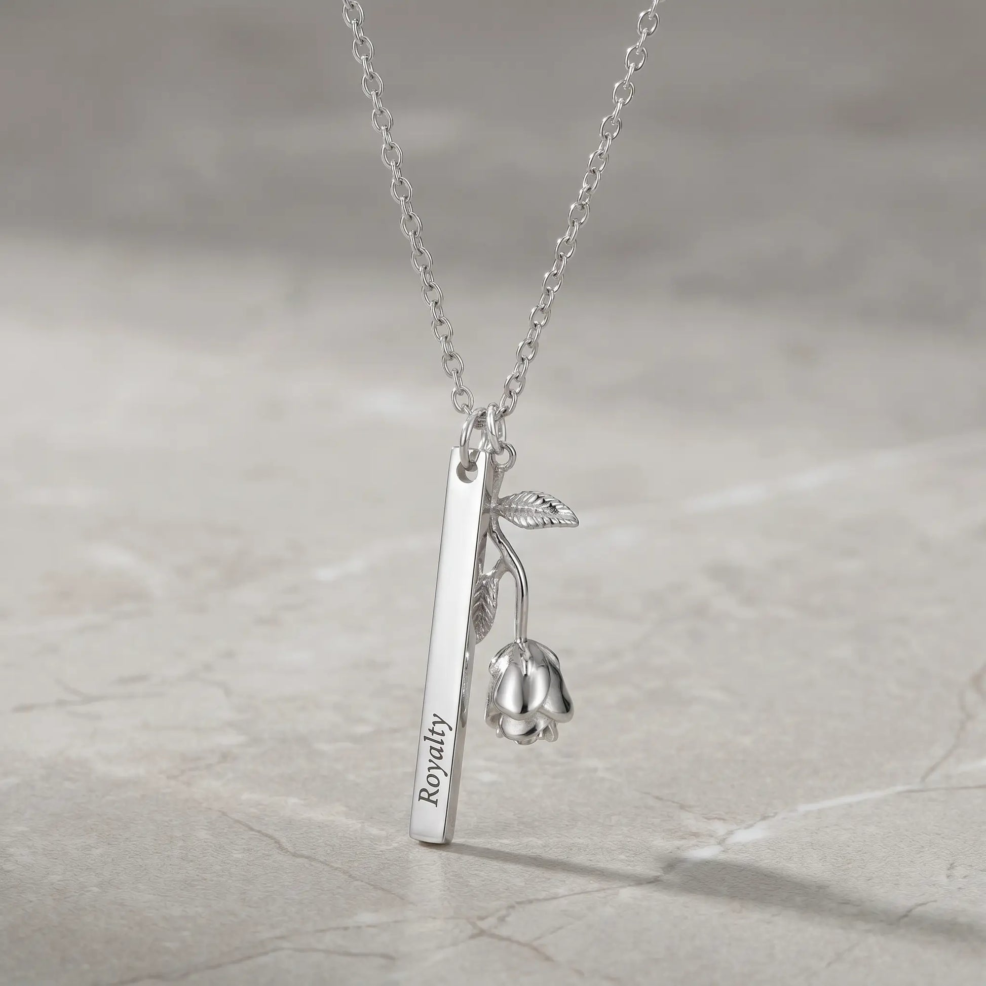 Rose Gold Engraved Bar Pendant in silver tone packshot with rose flower charm Royalty engraving