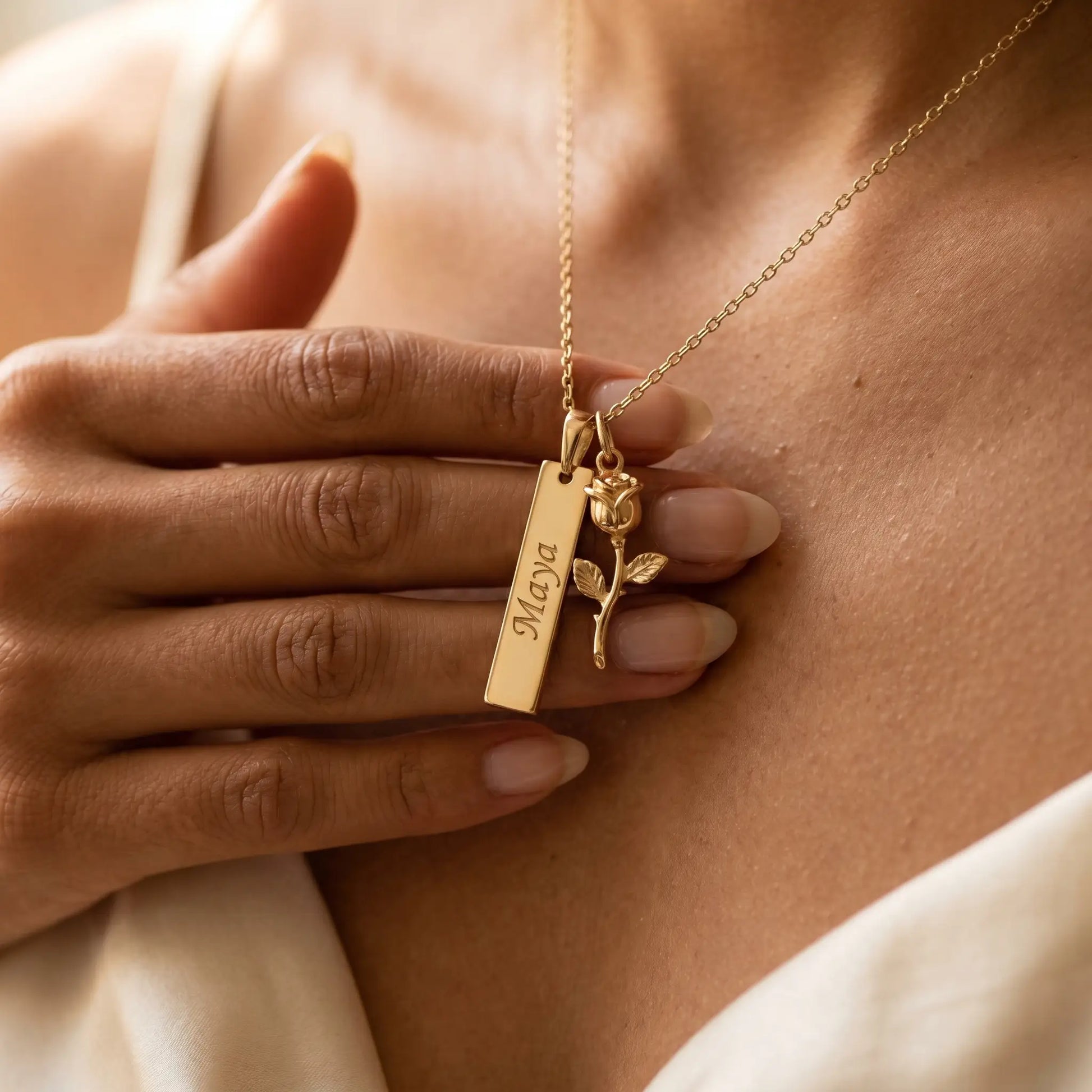Rose Gold Engraved Bar Pendant in 18K gold tender hand to jewelry close up Maya engraving