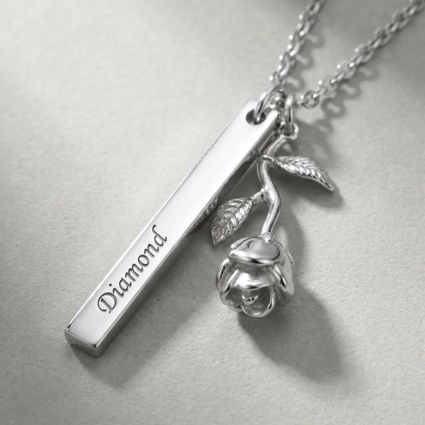 Rose Gold Engraved Bar Pendant in silver tone macro detail Diamond engraving and rose flower